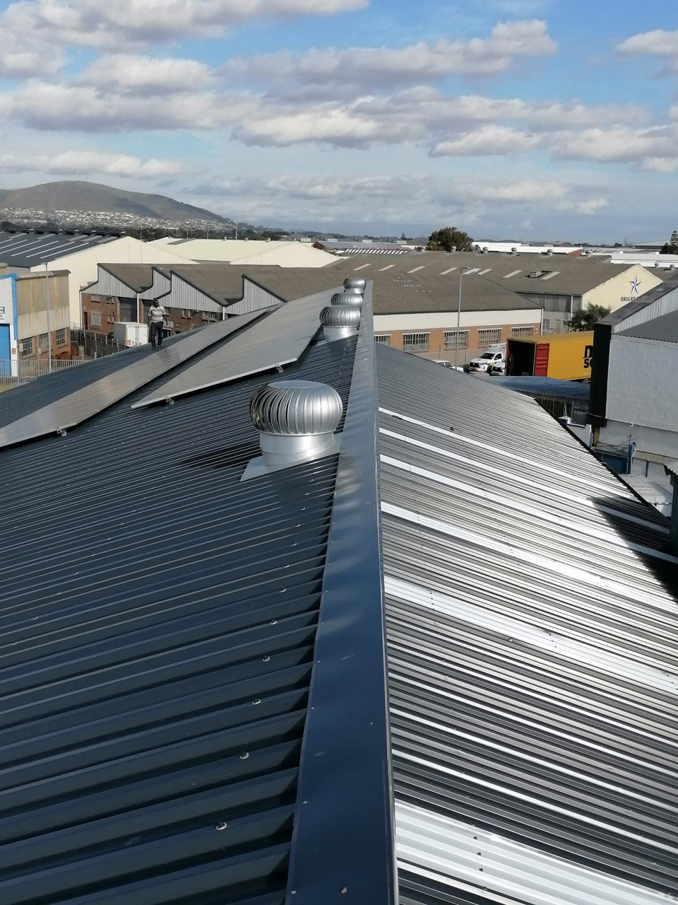 commercial roofing team rehabilitating a large roof in Cape Town