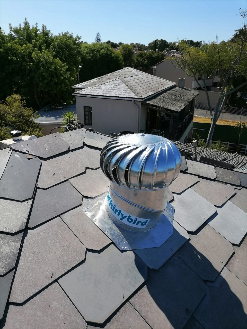 whirlybird roof vent installed on a metal roof